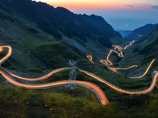 Lighted highway through mountainside switchbacks