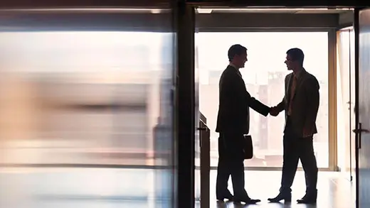 Two businessmen shaking hands